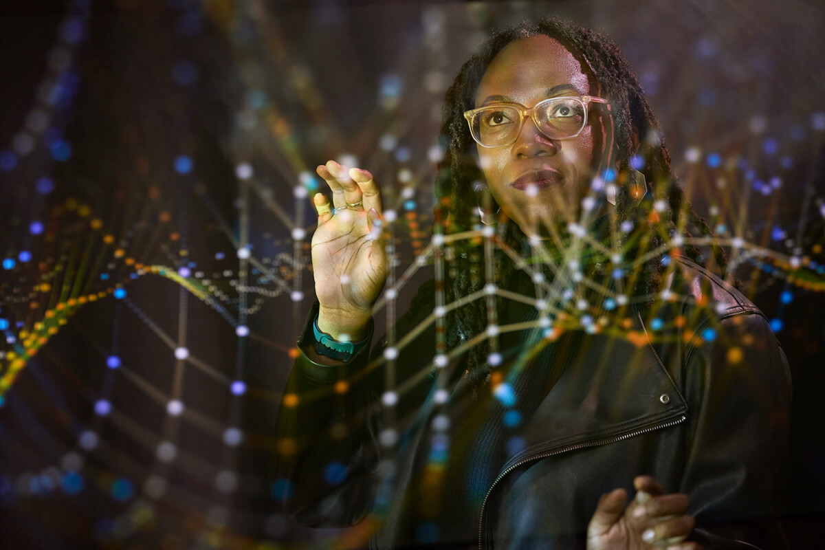 A woman interfacing with a transparent technology interface.