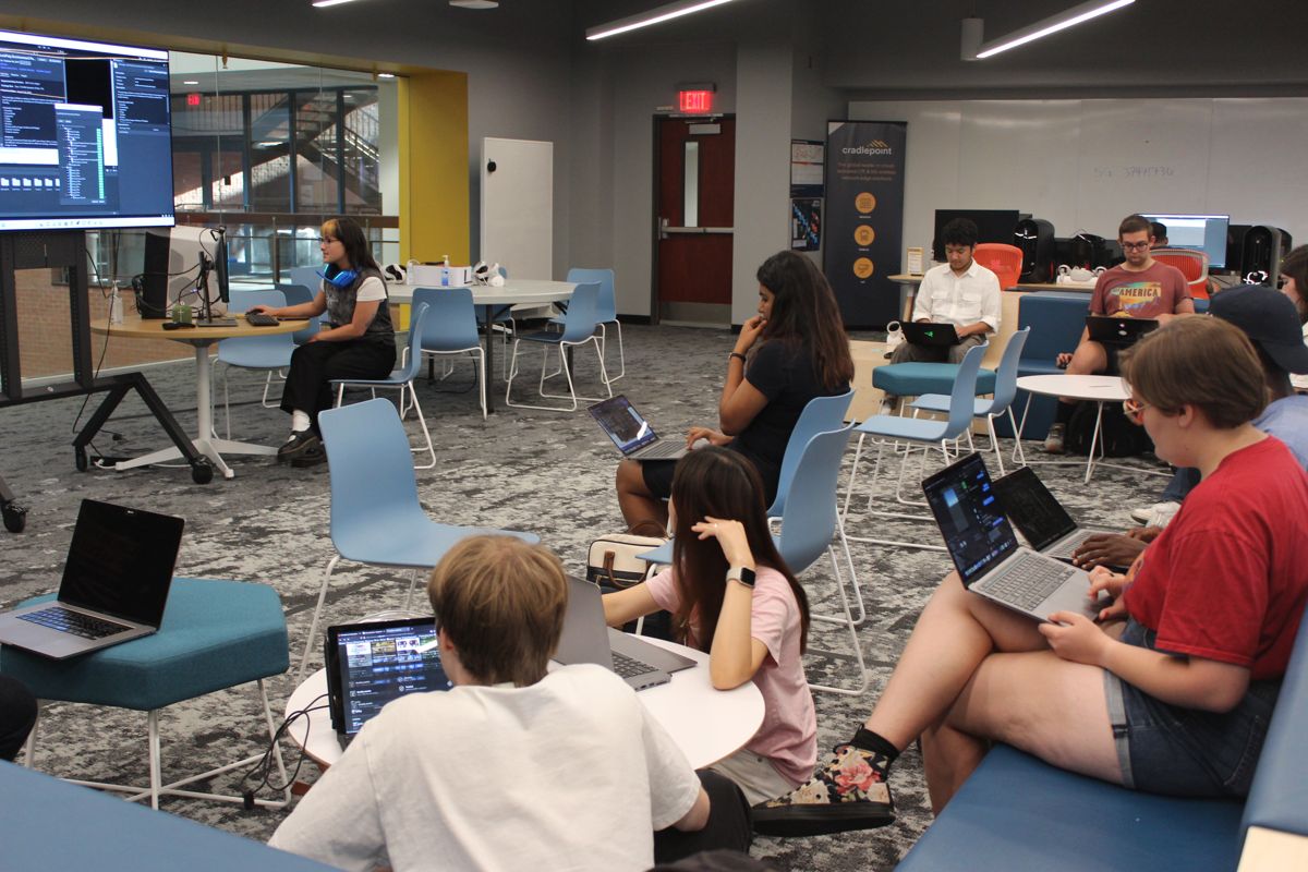 A group of students sitting in Next Lab, participating in a Unity game engine workshop.